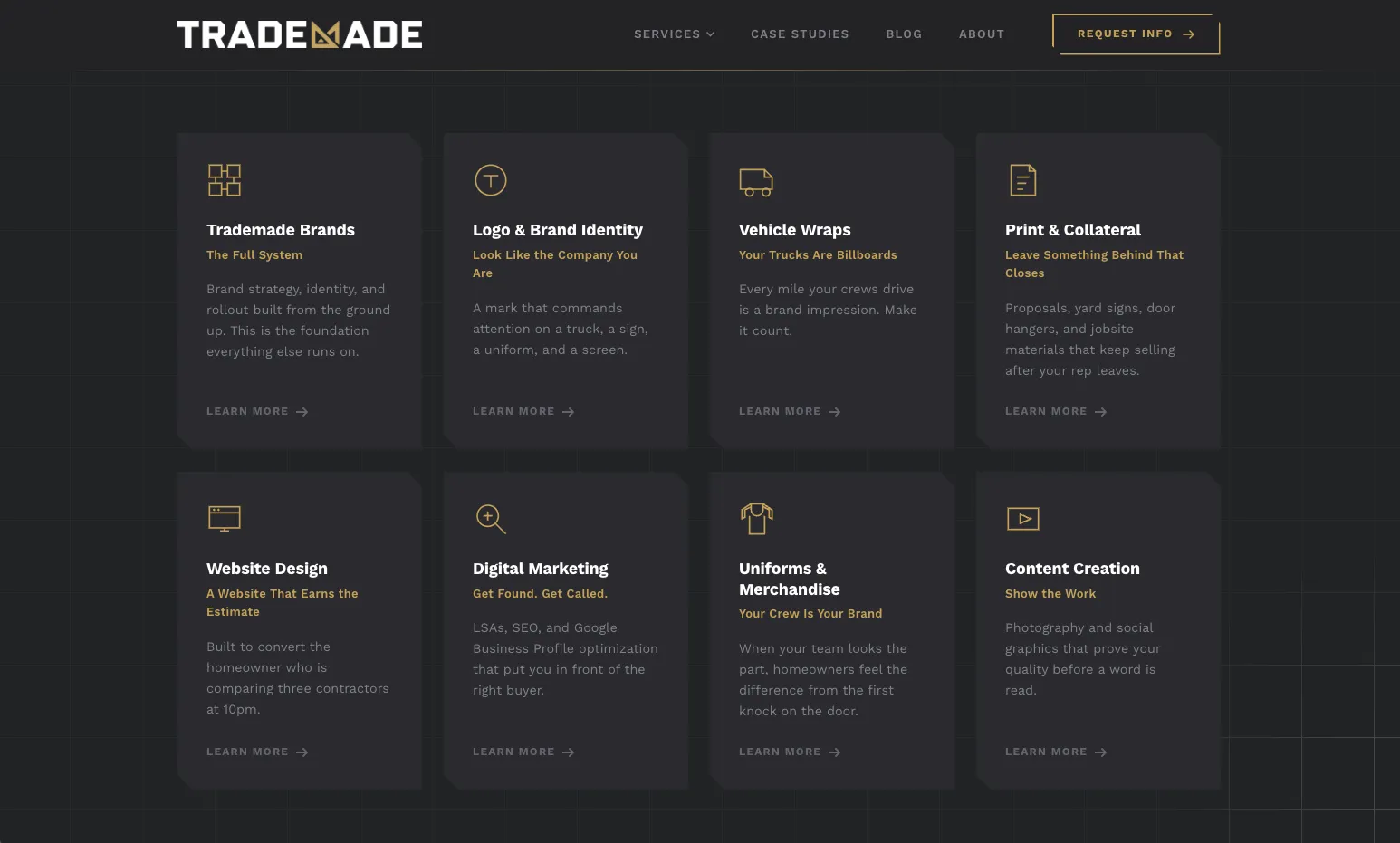 Trademade's services page: eight dark cards, from logo and brand identity to vehicle wraps and website design