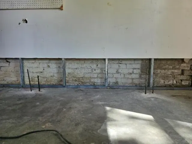 Brick foundation wall of a settling 1950s Denver home, opened up during Stratalock's repair
