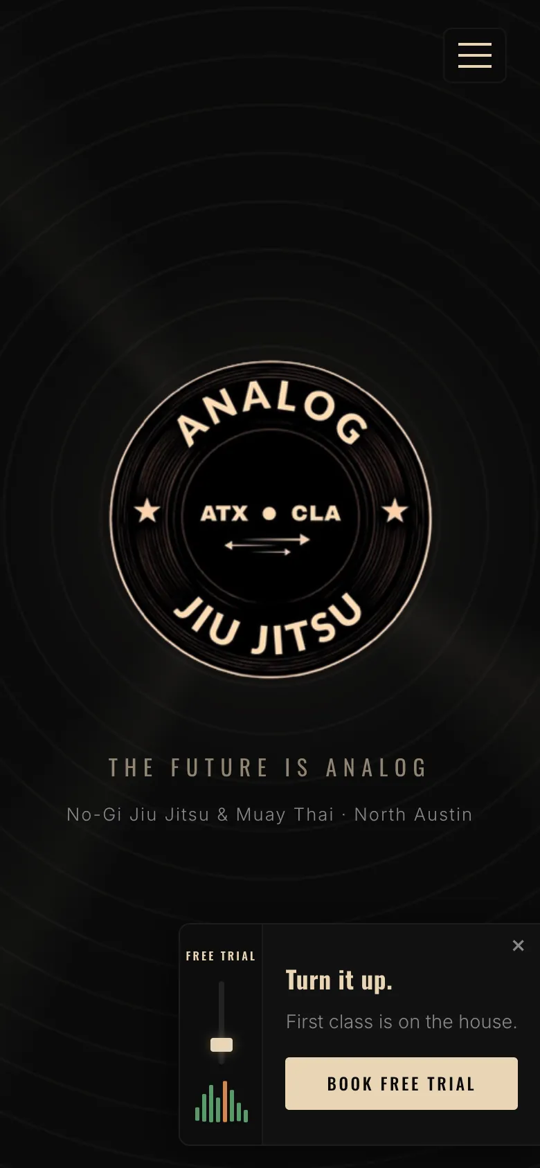 The Analog Jiu Jitsu homepage on a phone: the gym's round badge and a 'Book free trial' button.