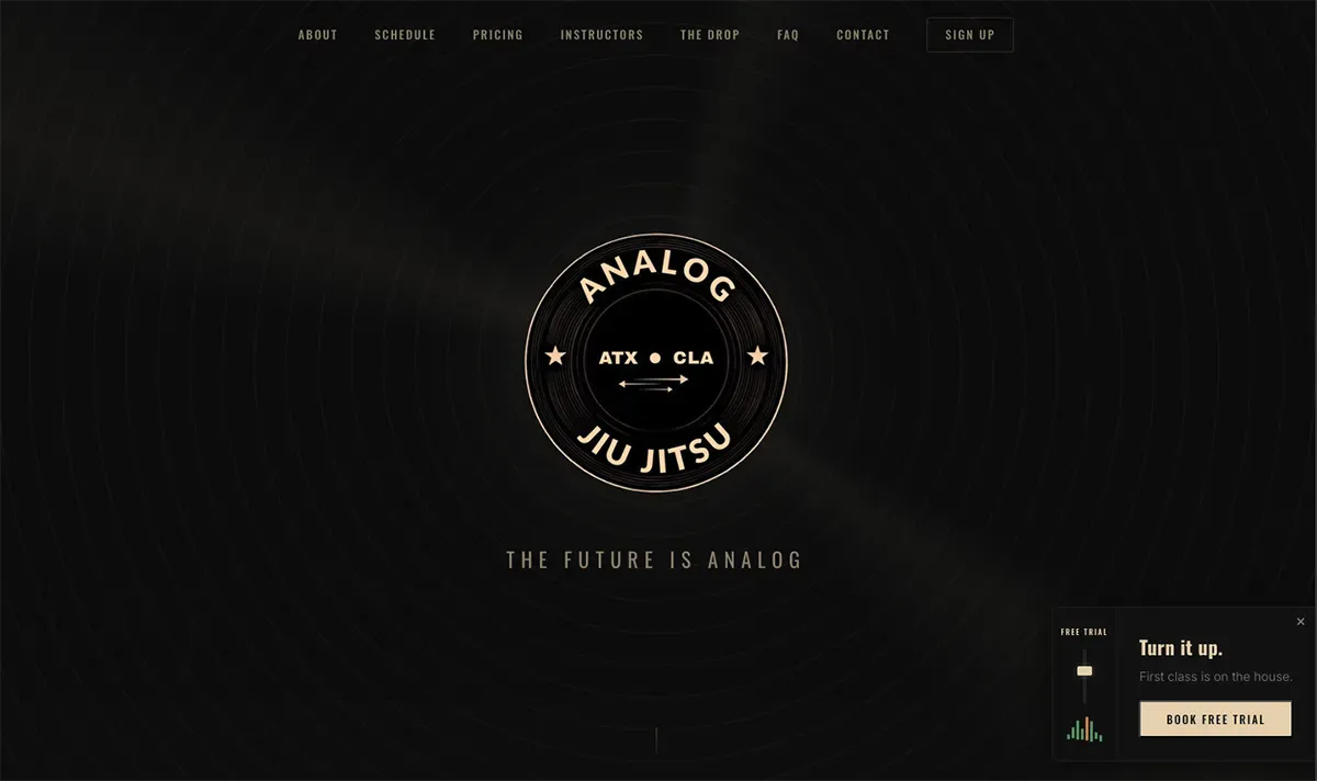 Analog Jiu Jitsu homepage: a round gym badge on a dark background under a simple top menu