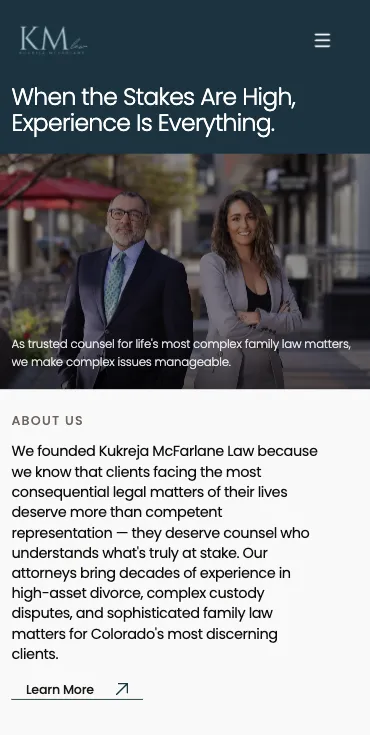 KM Law homepage on a phone: its headline above a photo of the two partners, then an About Us introduction