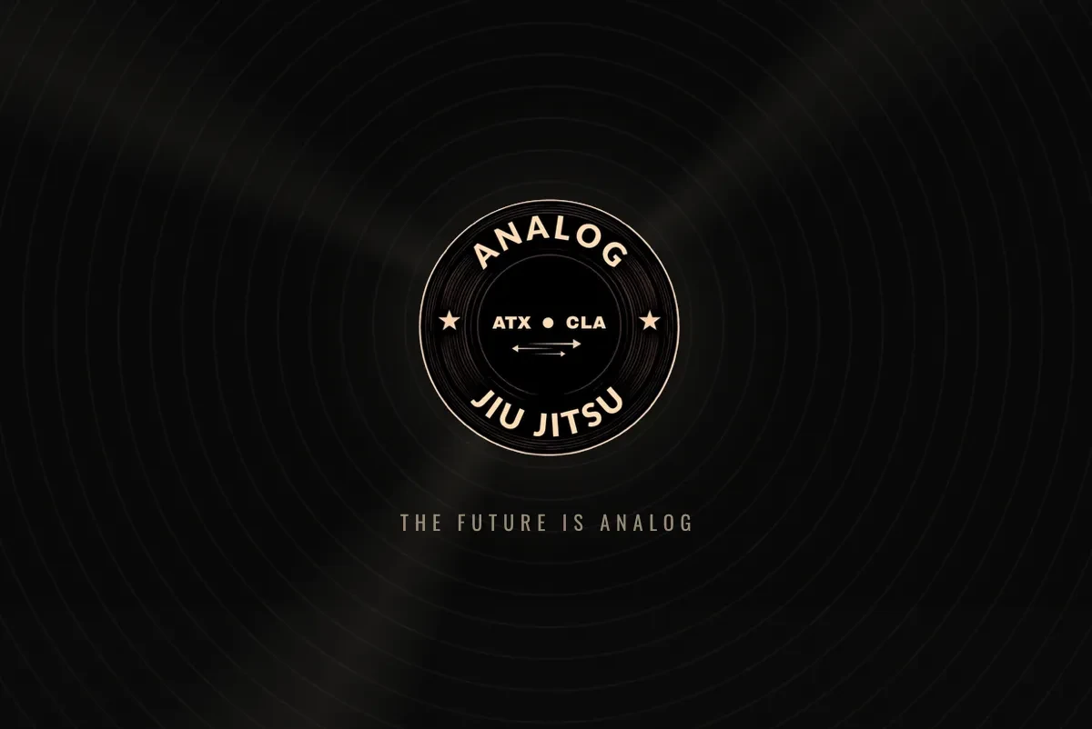 Analog Jiu Jitsu homepage: a black vinyl record with the round Analog Jiu Jitsu ATX badge and The Future Is Analog